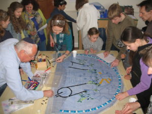 Beiteinu pupils working on the Shalom Mosaic that welcomes all to KLS